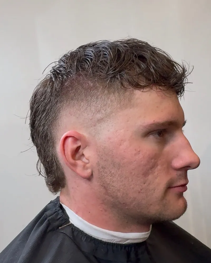 Same client after a sharp cut and beard line-up.