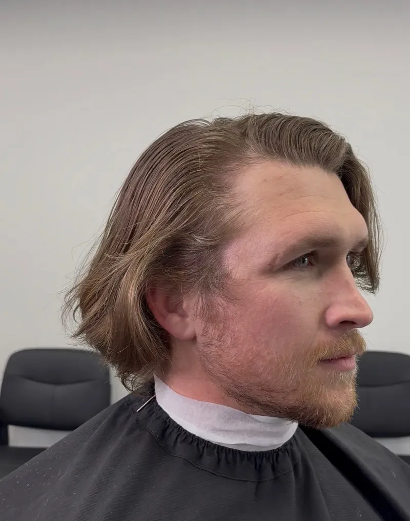 Client before a haircut at Main Street Barbers.